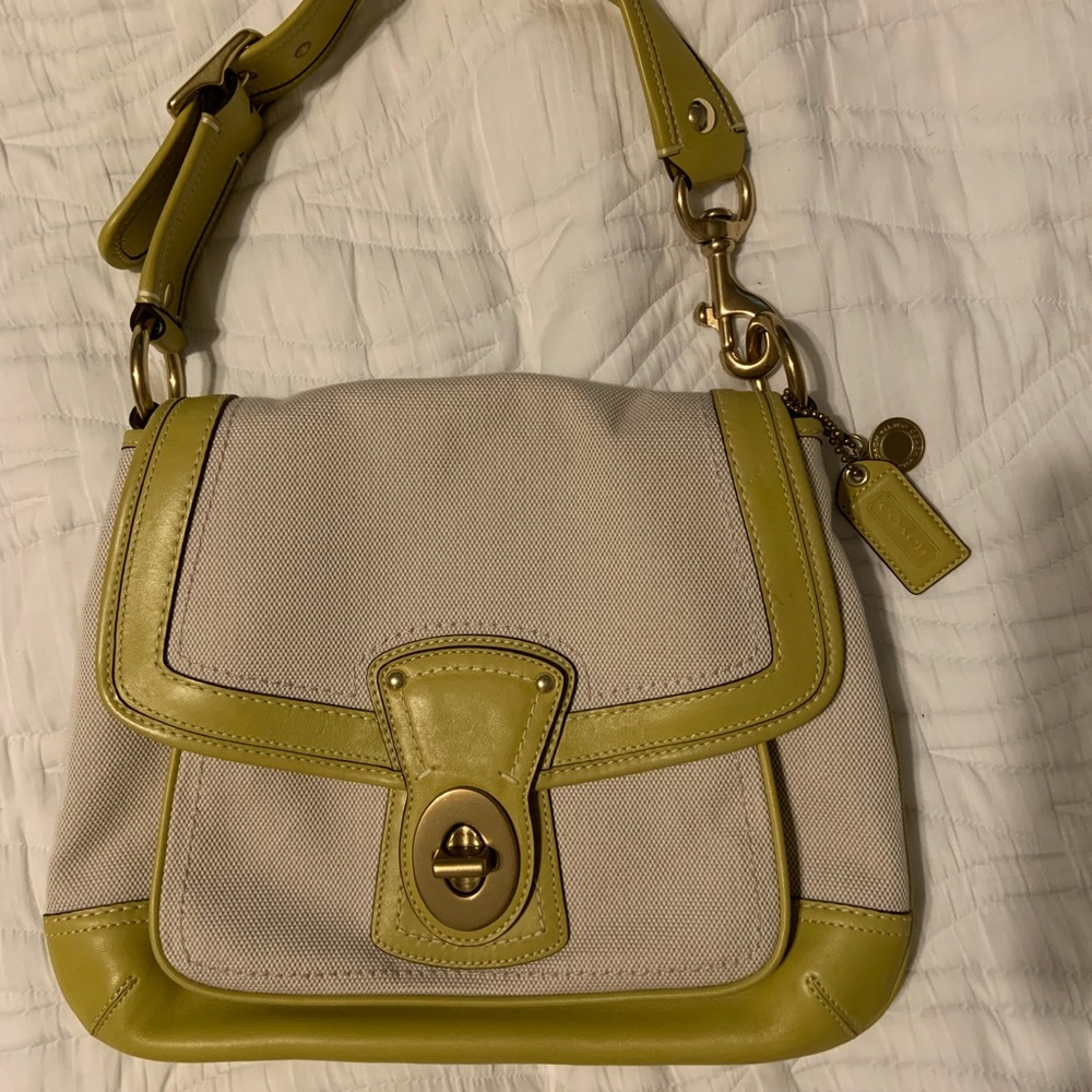 Never been carried Coach shoulder bag.